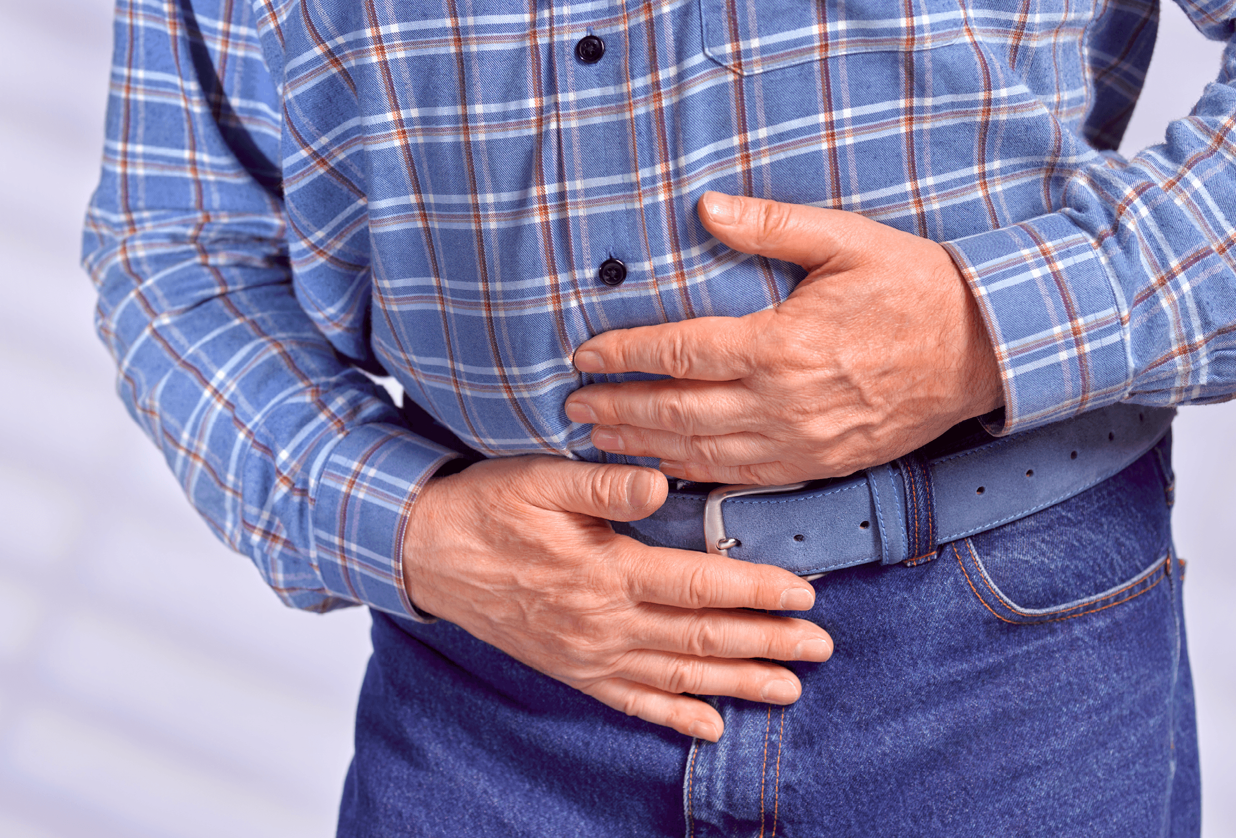 man holding stomach in pain